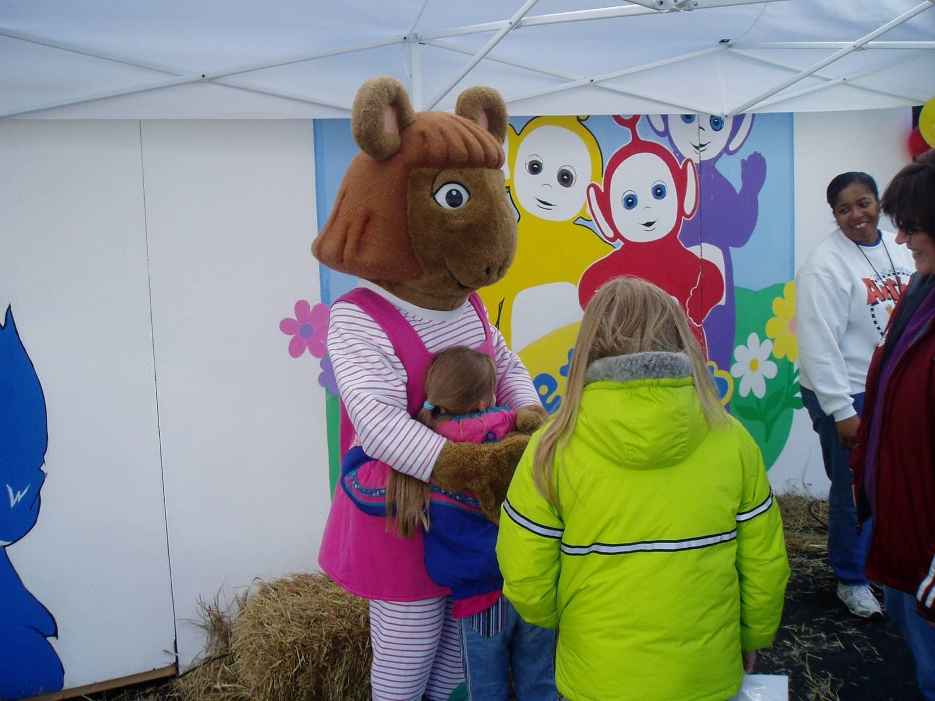 Princess Wallace, dressed as D.W. Read from Arthur, greets young fans