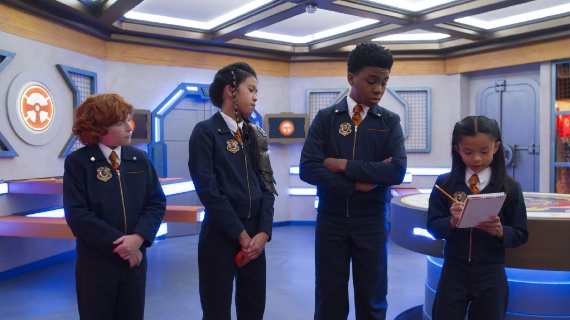 Members of the Odd Squad standing in a line.