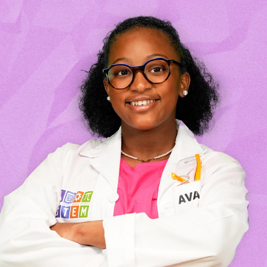 Ava Simmons or Ava the STEM Princess posing in front of a purple background.