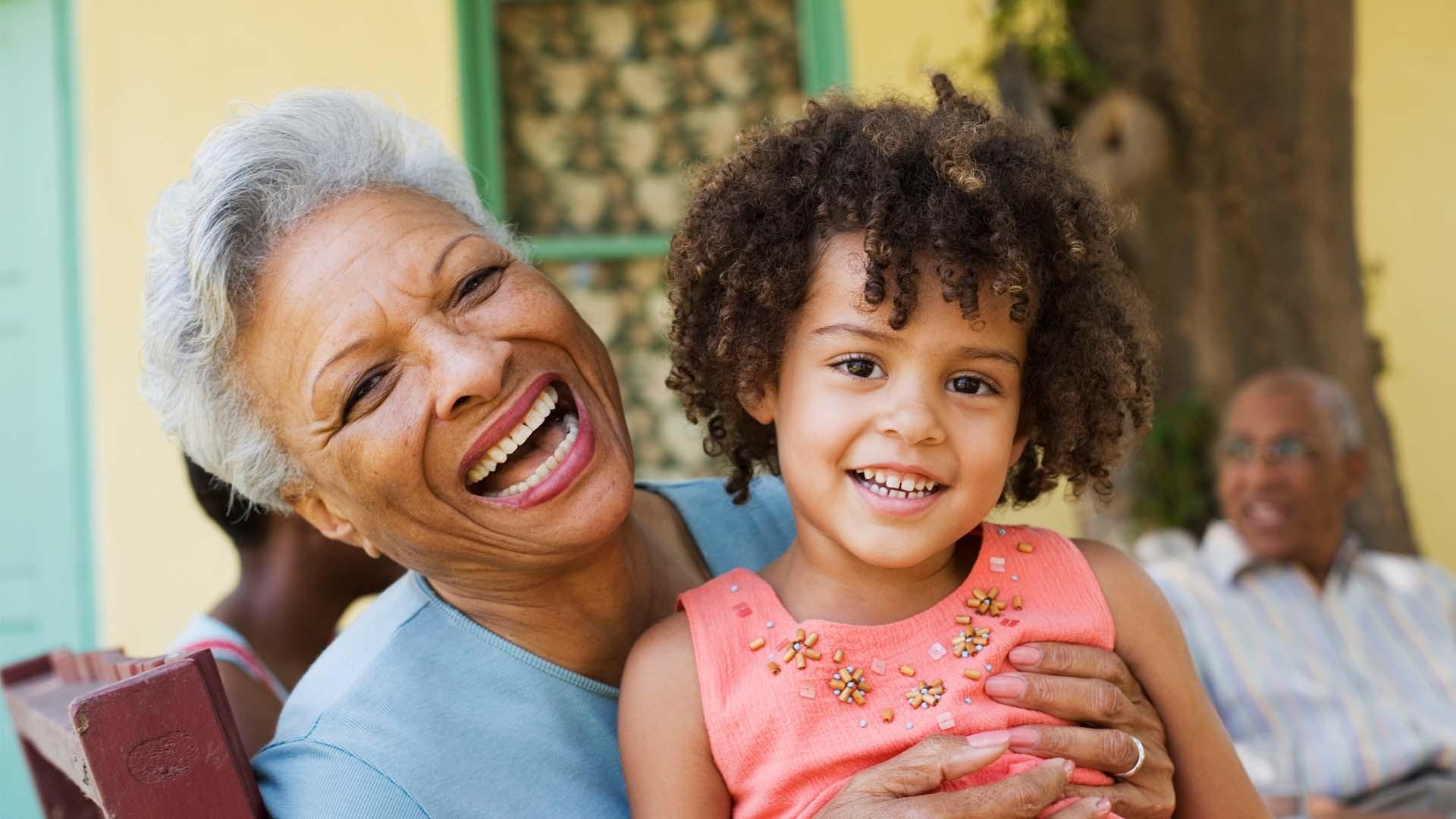 Grandmother and child smiling together