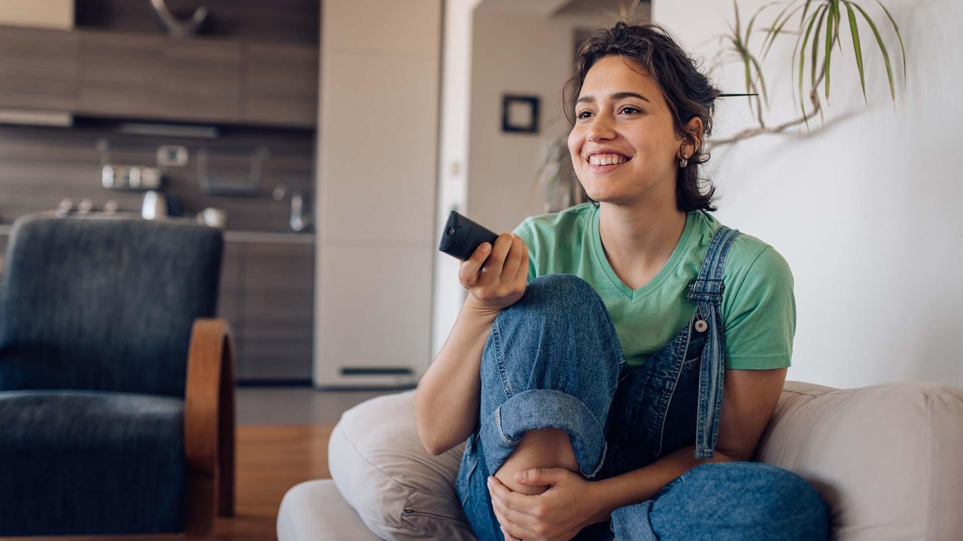 woman-holding-tv-remote