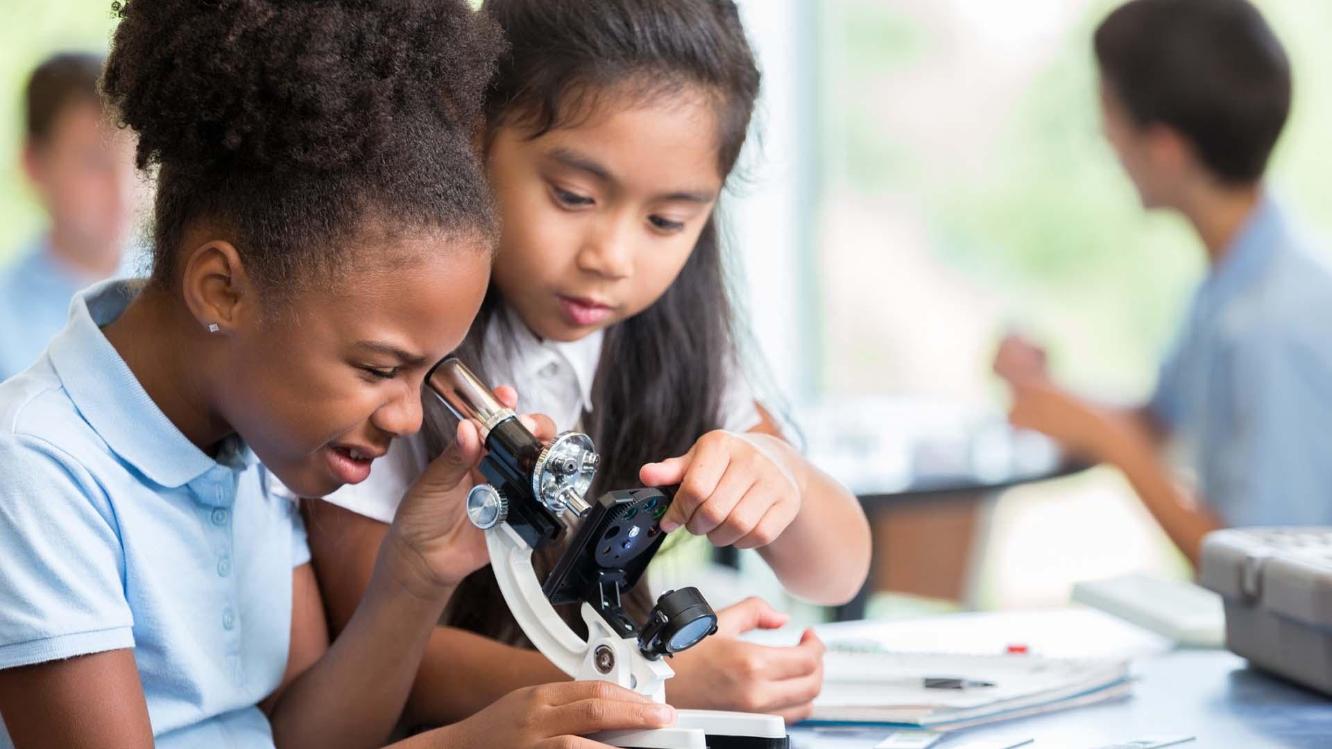 black-and-asian-child-science-class